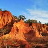 Discover the breathtaking landscapes of Marafa Hell’s Kitchen, where dramatic sandstone formations glow in stunning shades of red, orange, and gold.